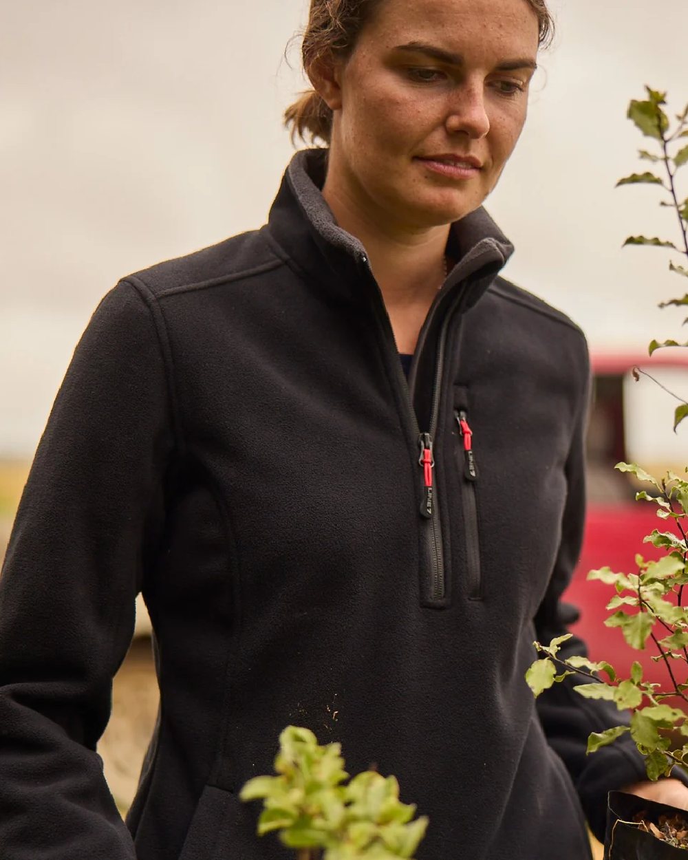 Black Coloured Line 7 Womens Territory Wind Pro Half Zip Fleece Jacket on sky background 