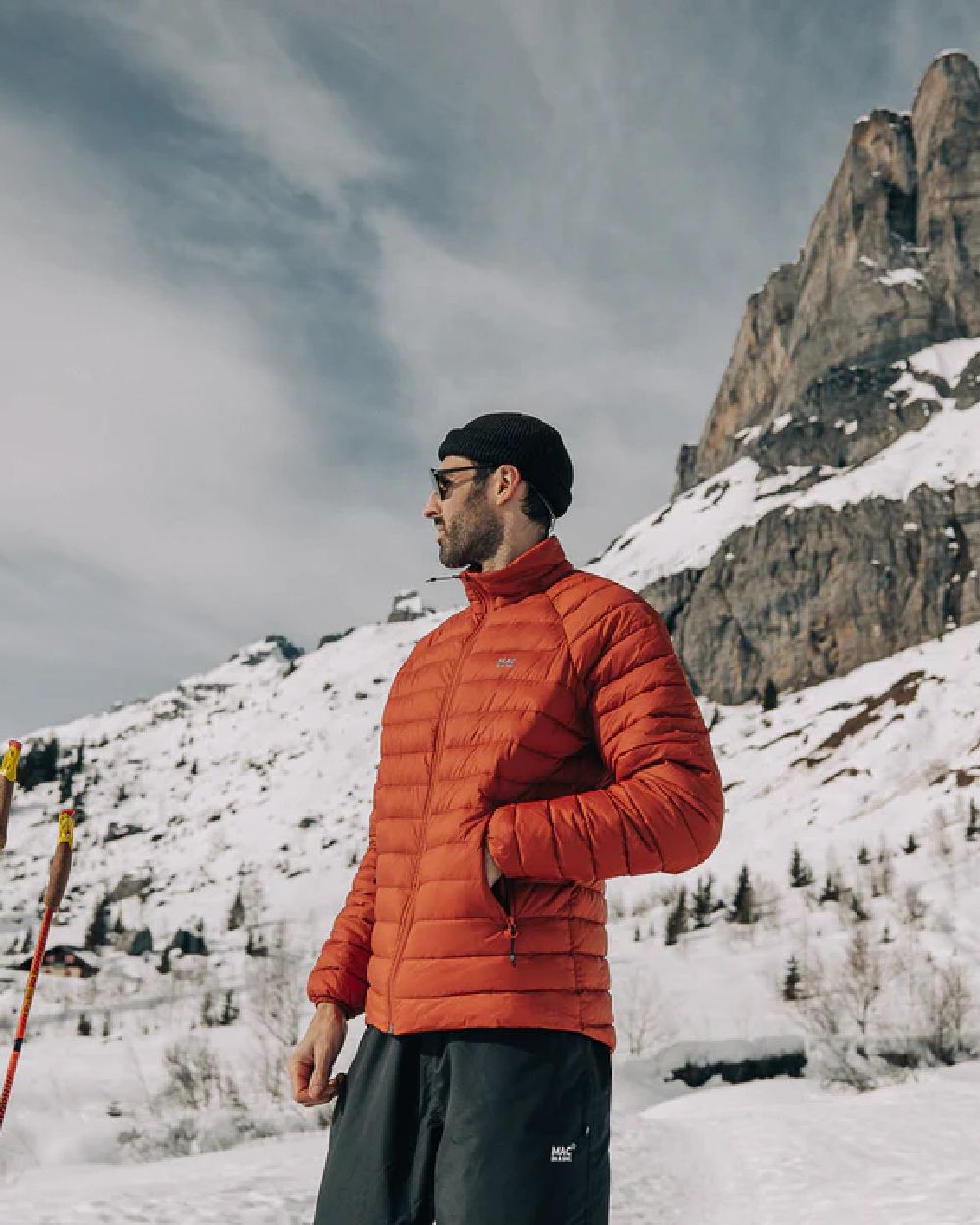 Burnt Orange coloured Mac In A Sac Mens Synergy Jacket on snow background 