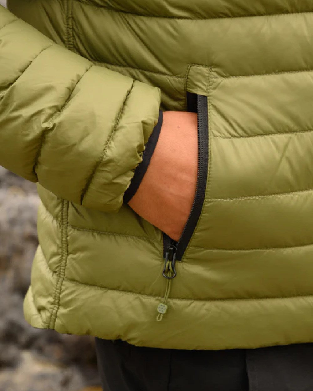 Khaki Black coloured Mac In A Sac Packable Mens Polar Down Jacket on blurry background 