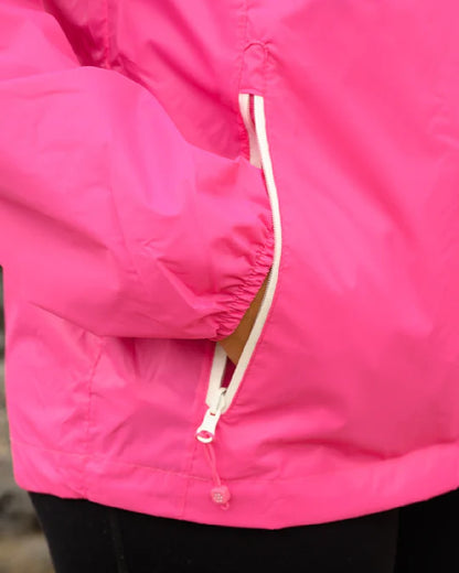 Pink coloured Mac In A Sac Packable Origin Waterproof Jacket on blurry background 