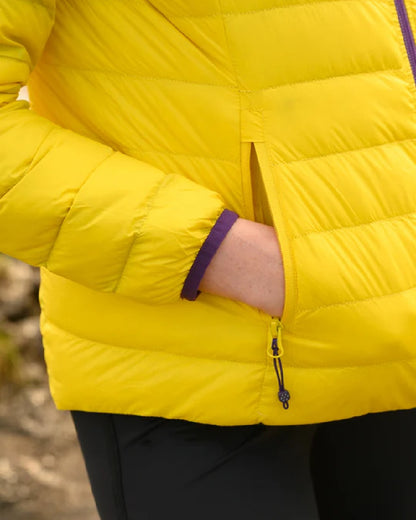 Yellow Grape coloured Mac In A Sac Packable Womens Down Jacket on blurry background 