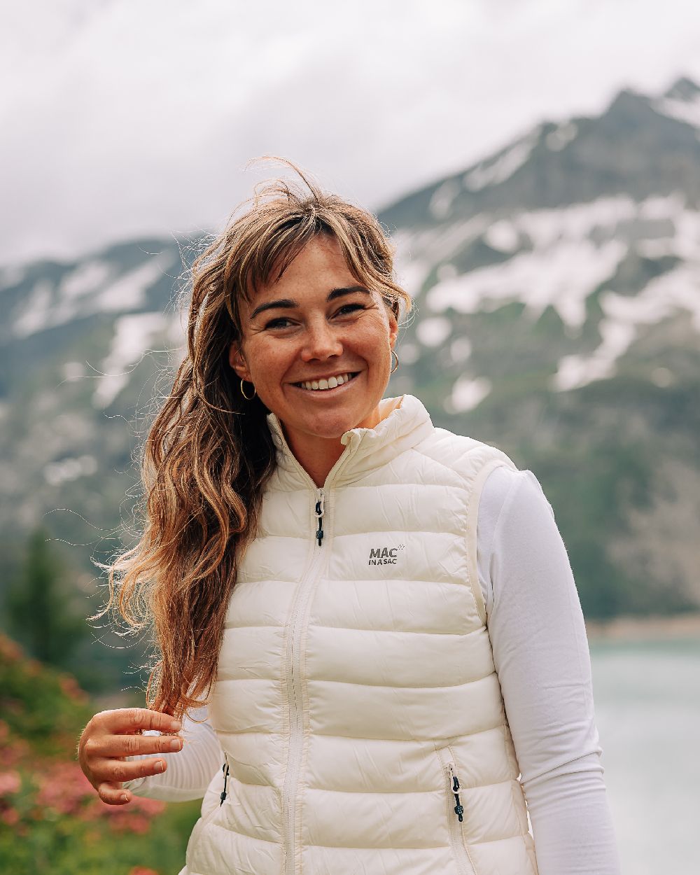 Ivory Coloured Mac In A Sac Womens Synergy Gilet on mountain background 
