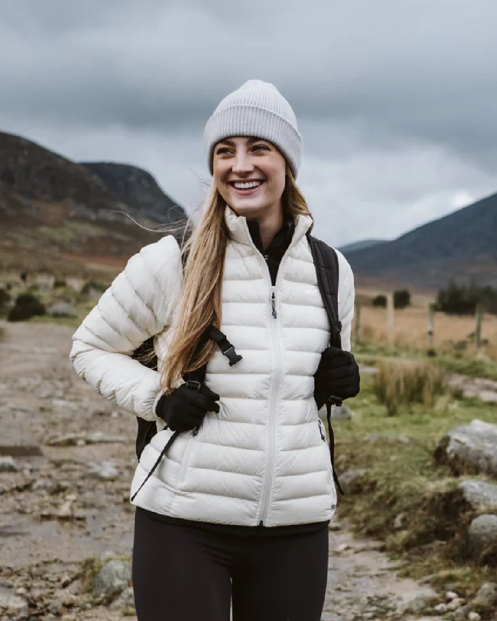 Ivory coloured Mac In A Sac Womens Synergy Jacket on blurry mountain background 