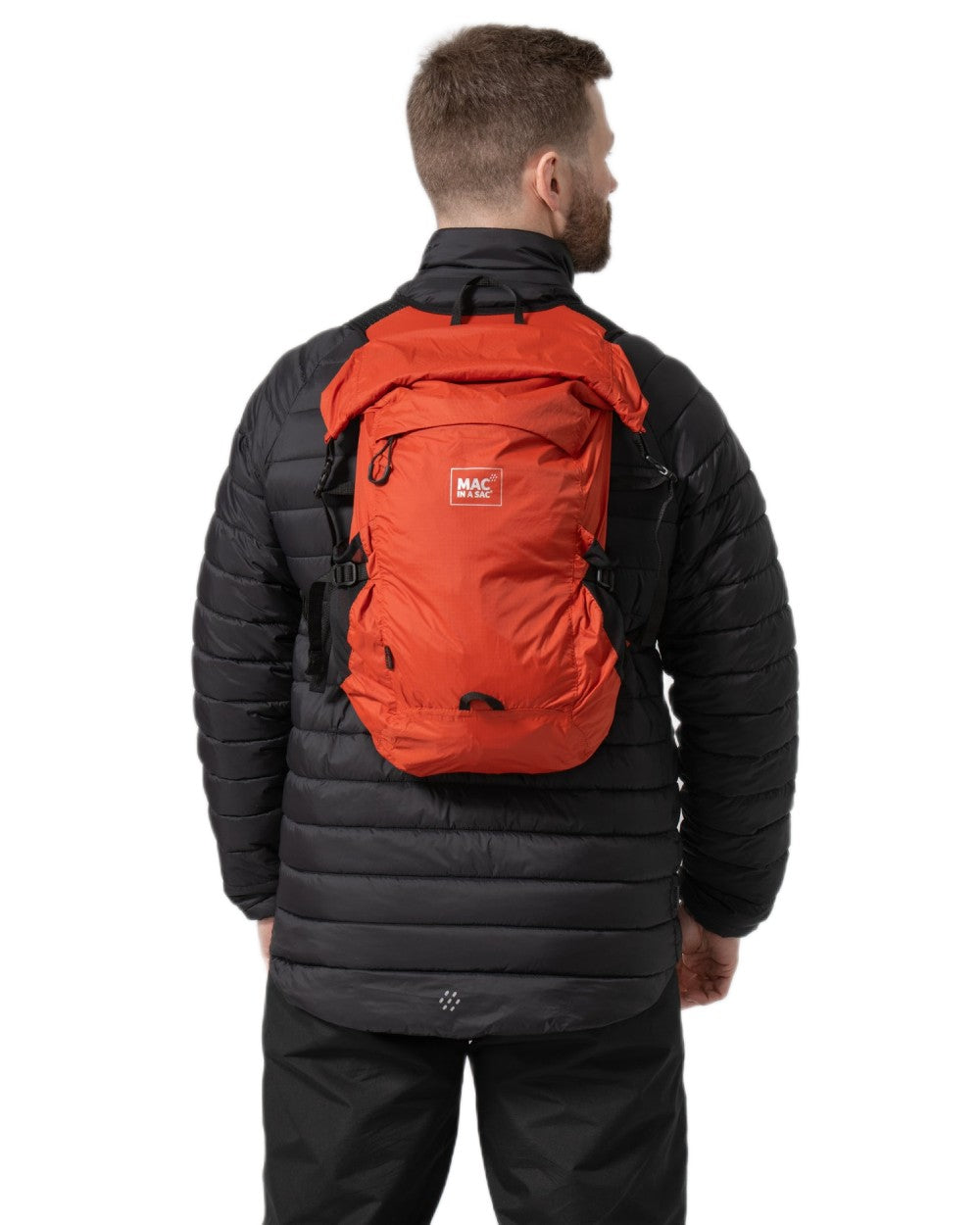 Burnt Orange coloured Mac In A Sac Travelite Packable Waterproof Backpack on white background 