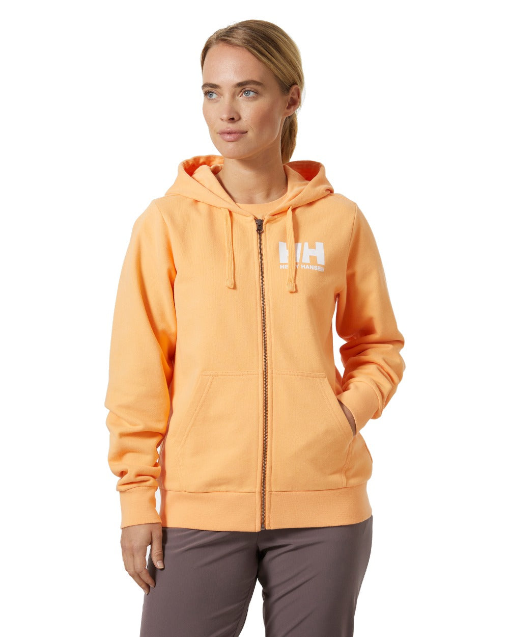 Miami Peach coloured Helly Hansen Womens HH Logo Full Zip Hoodie on a white background 