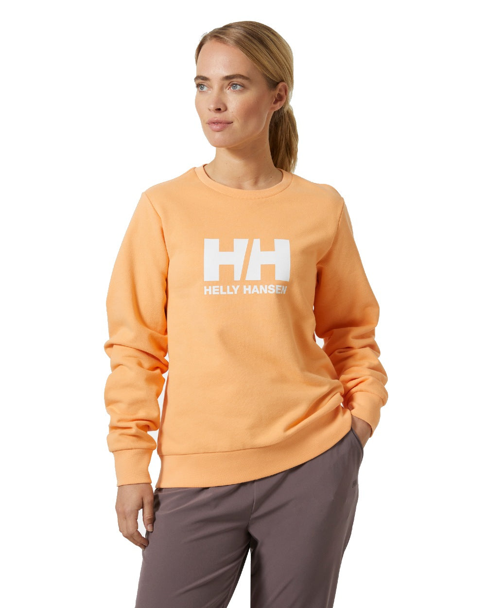 Miami Peach coloured Helly Hansen Womens Logo Crew Sheatshirt 2.0 on a white background 