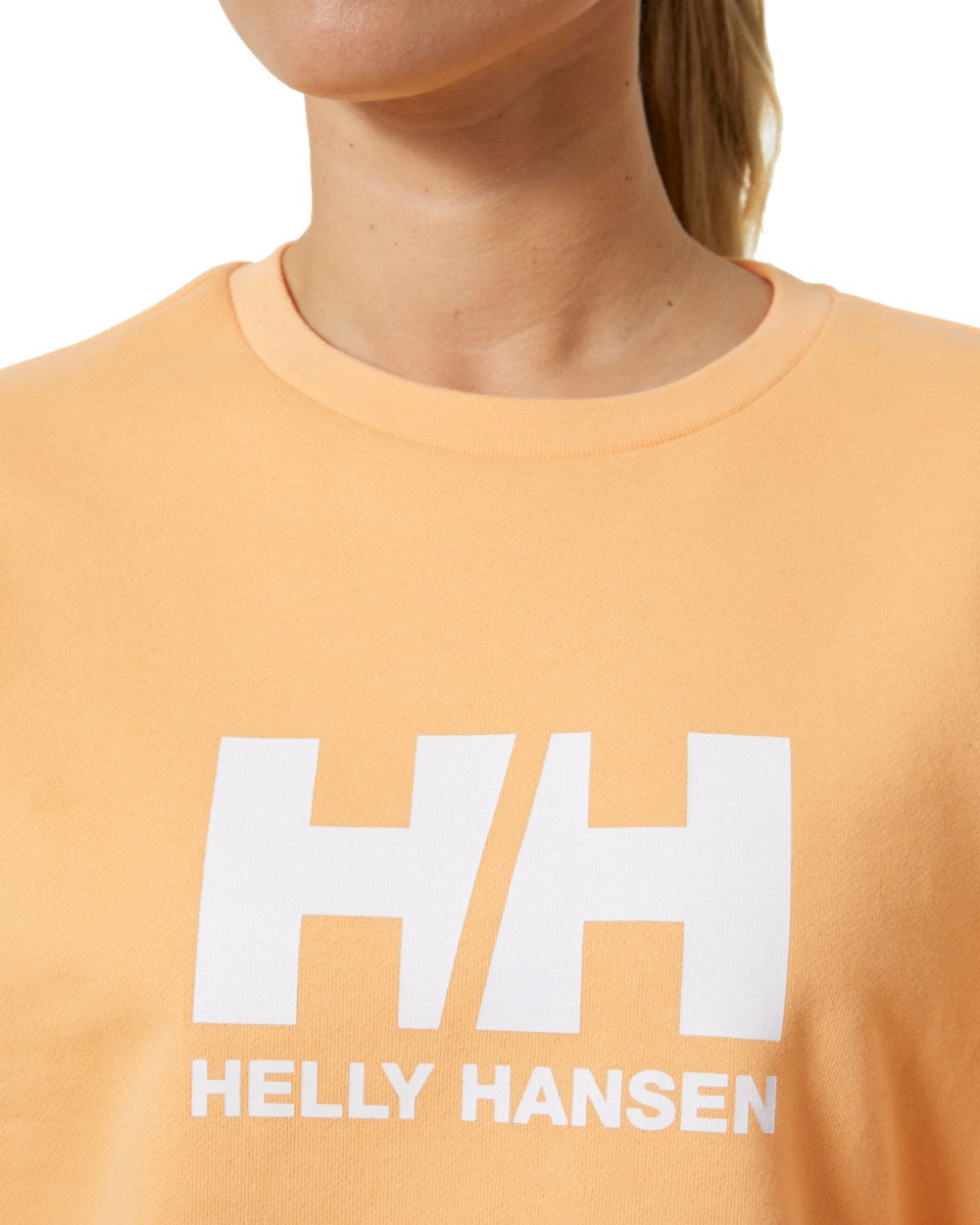 Miami Peach coloured Helly Hansen Womens Logo Crew Sheatshirt 2.0 on a white background 