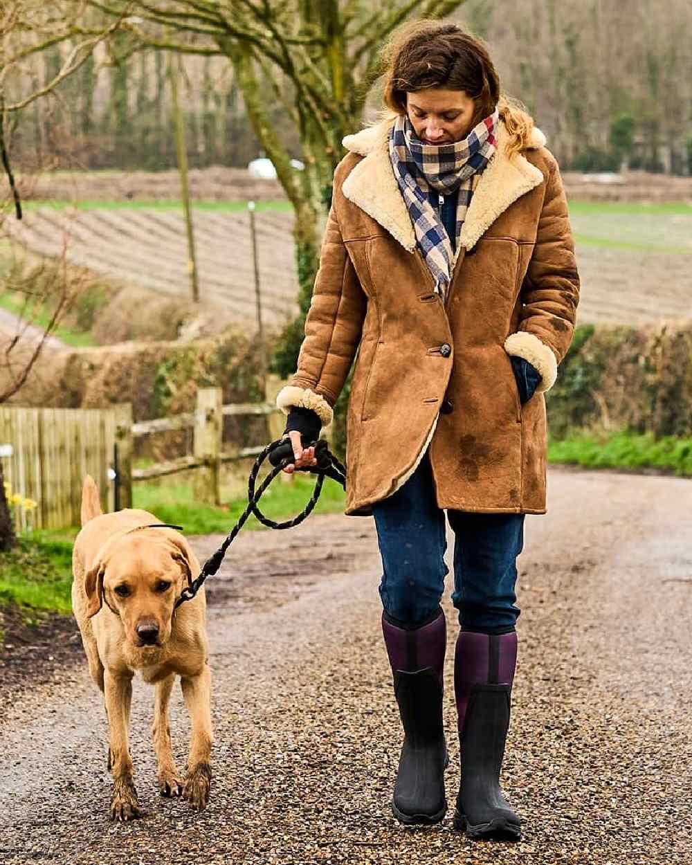 Magenta Digi Fade Print Coloured Muck Boots Womens Arctic Sport II Tall Wellingtons on countryside background 