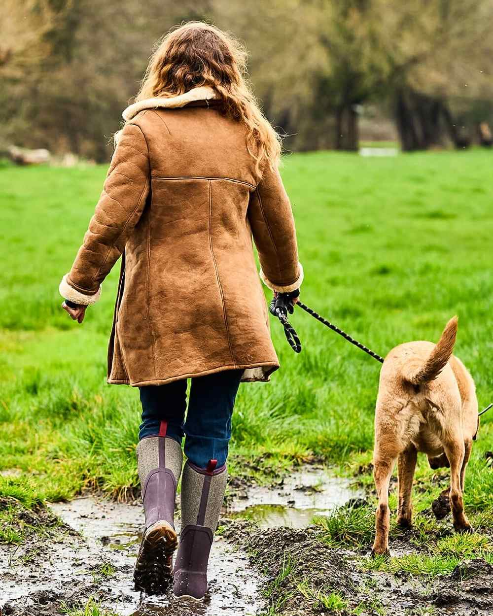 Wine Herringbone Print Coloured Muck Boots Womens Arctic Sport II Tall Wellingtons on countryside background 