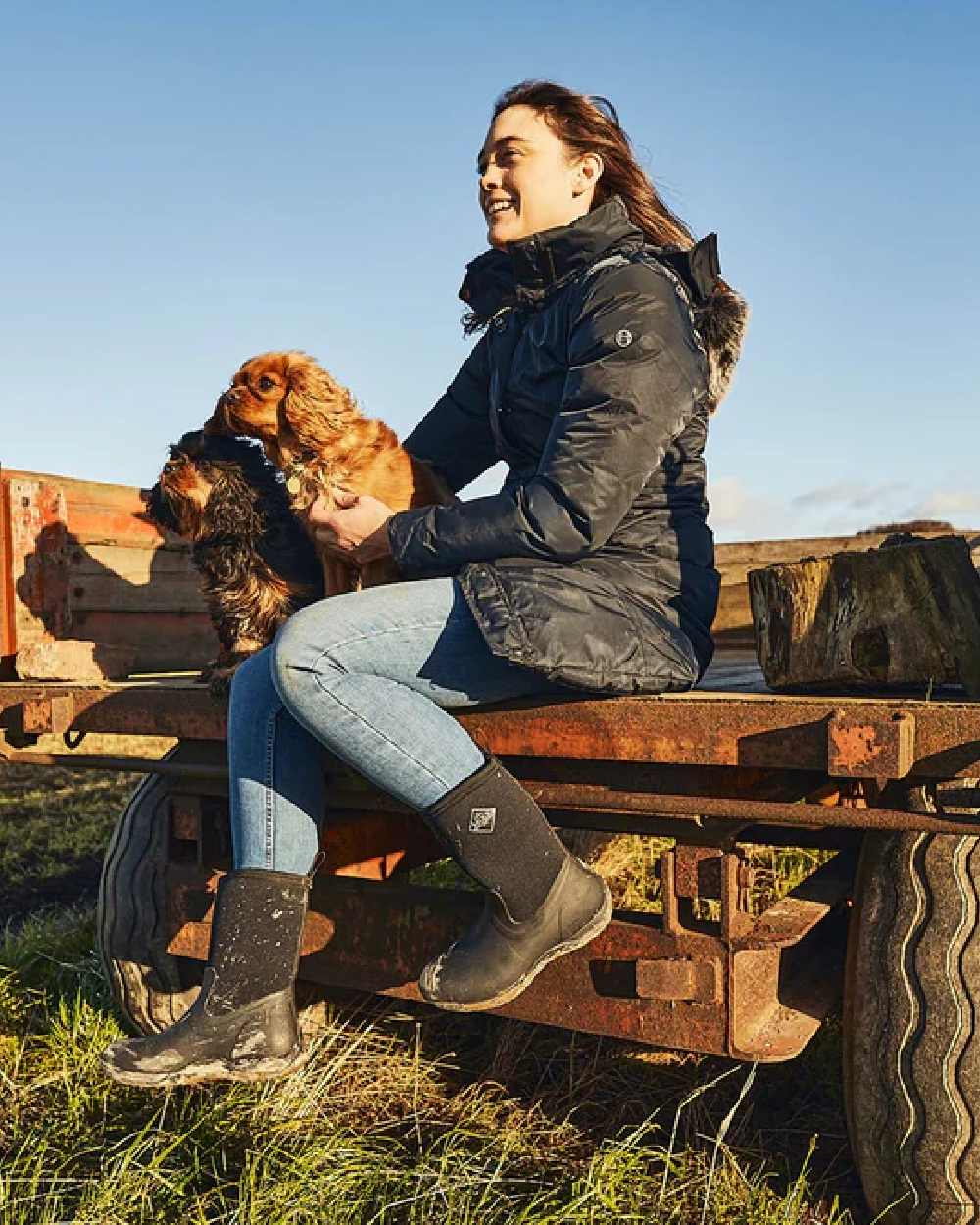 Black Coloured Muck Boots Womens Arctic Weekend Mid Wellingtons on countryside background 