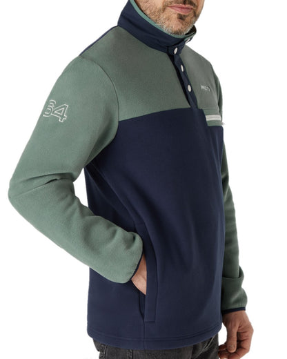 Navy Duck Green Coloured Musto 64 Fleece Pullover On A White Background 