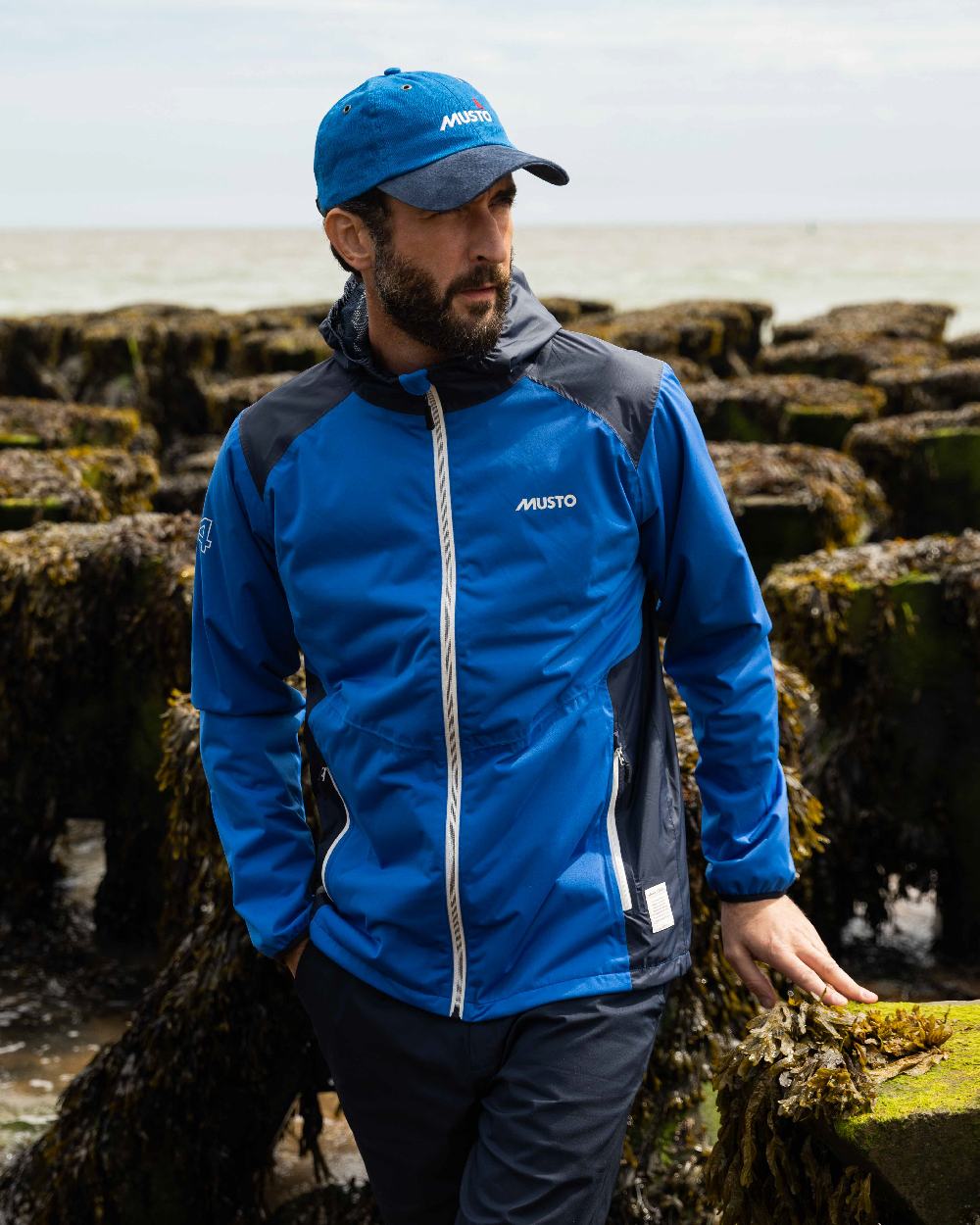 Aruba coloured Musto Essential Fast Dry Crew Cap on outdoor background 