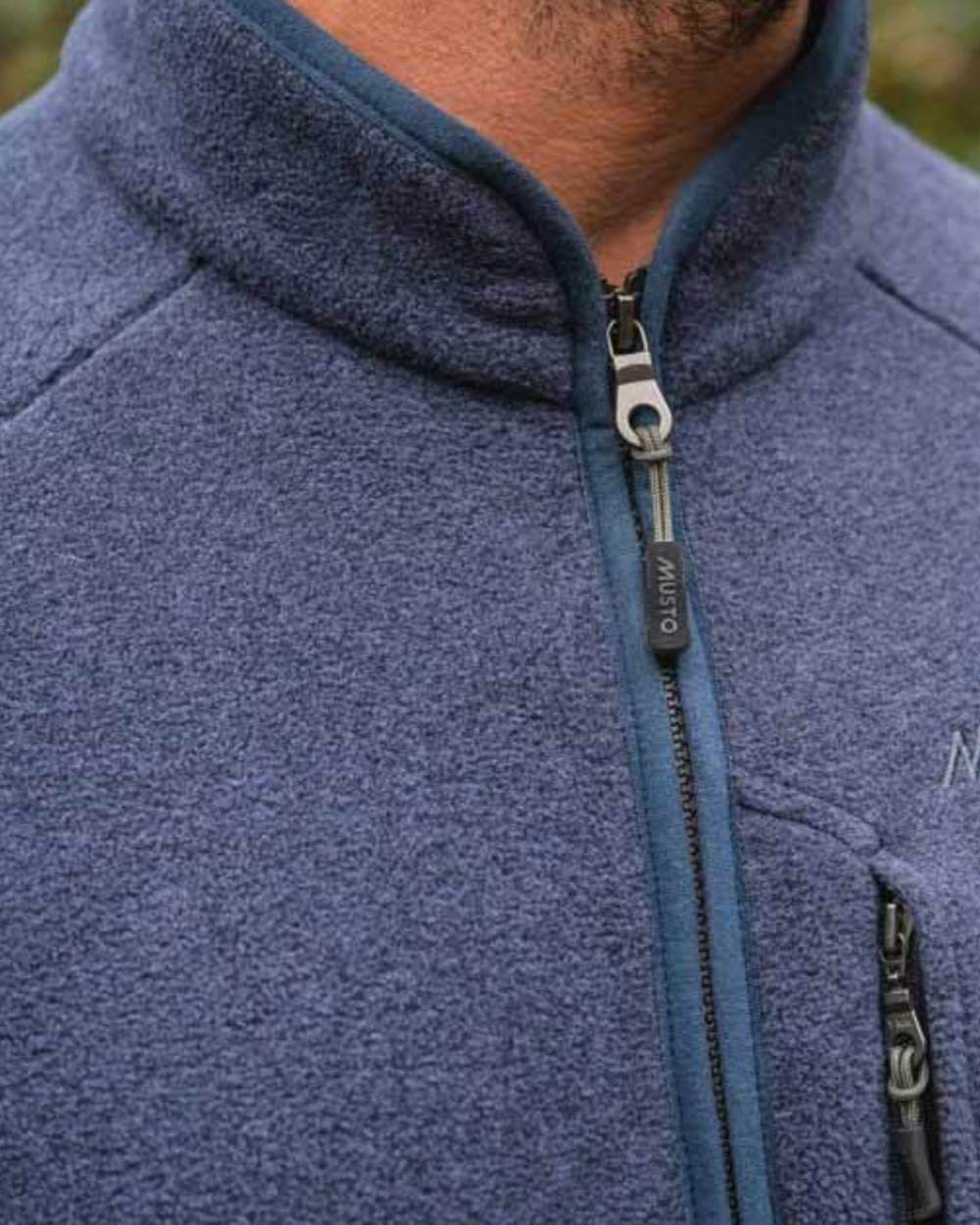 Navy Coloured Musto Fenland Polartec Fleece Vest on outdoor background 