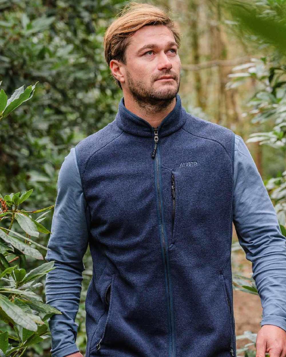 Navy Coloured Musto Fenland Polartec Fleece Vest on outdoor background 