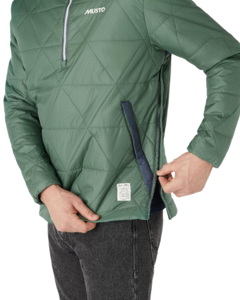 Duck Green Coloured Musto Mens 64 Snug Quilt Anorak on white background 