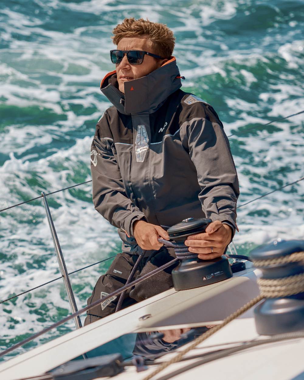 Charcoal coloured Musto Mens BR3 Pertex Offshore Jacket on sea background 
