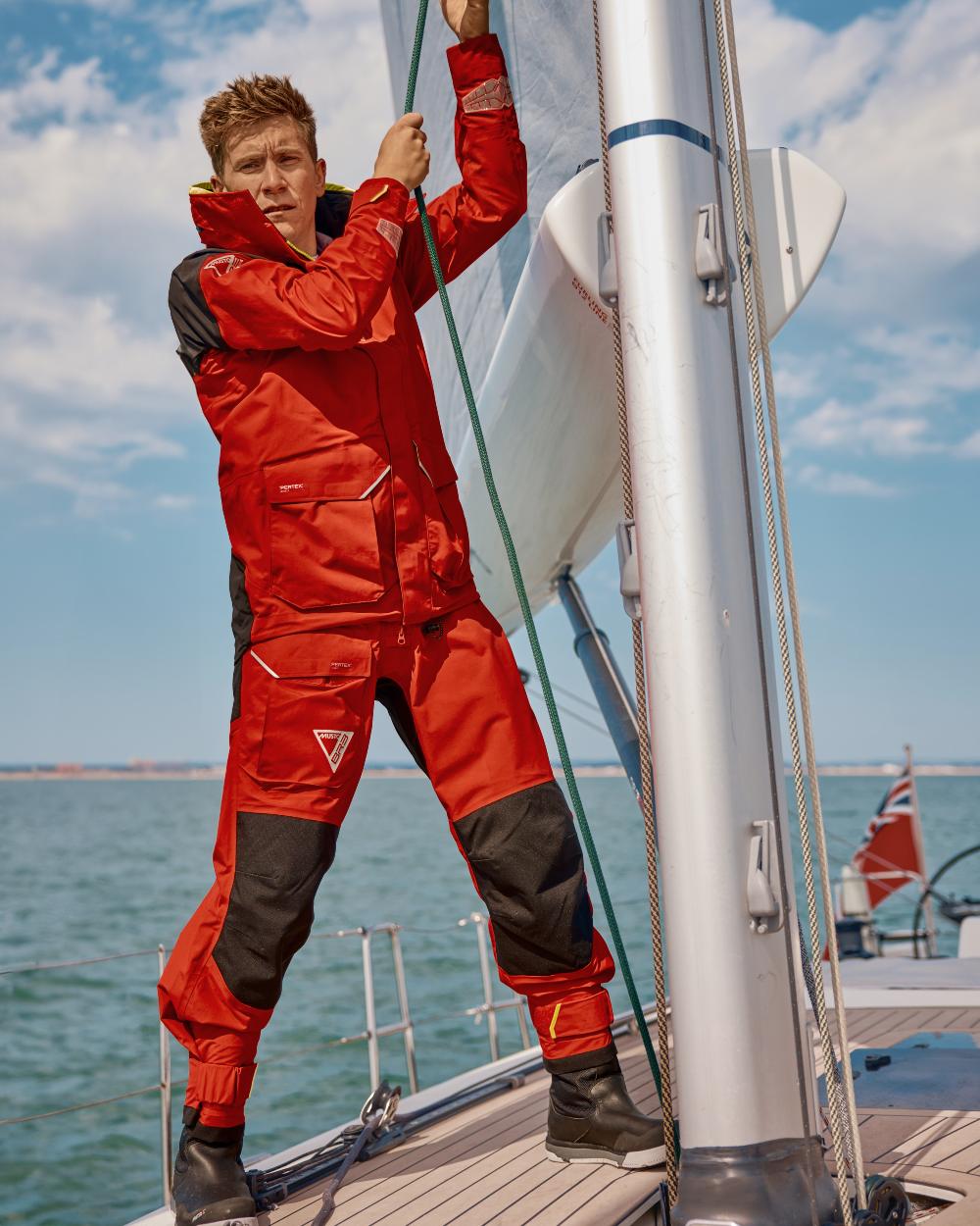 True Red coloured Musto Mens BR3 Pertex Offshore Jacket on sea background 