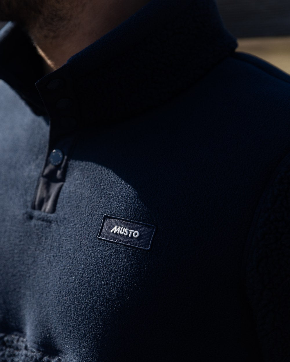 Navy Coloured Musto Mens Cover Deep Pile Fleece Jacket on outdoor background 