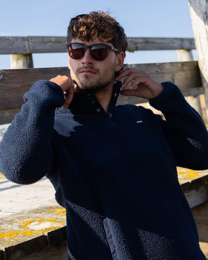 Navy Coloured Musto Mens Cover Deep Pile Fleece Jacket on outdoor background 