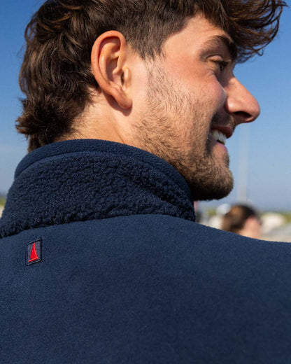 Navy Coloured Musto Mens Cover Deep Pile Fleece Jacket on outdoor background 