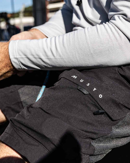 Black Coloured Musto Mens Evo Performance Stretch Shorts on outdoor background 