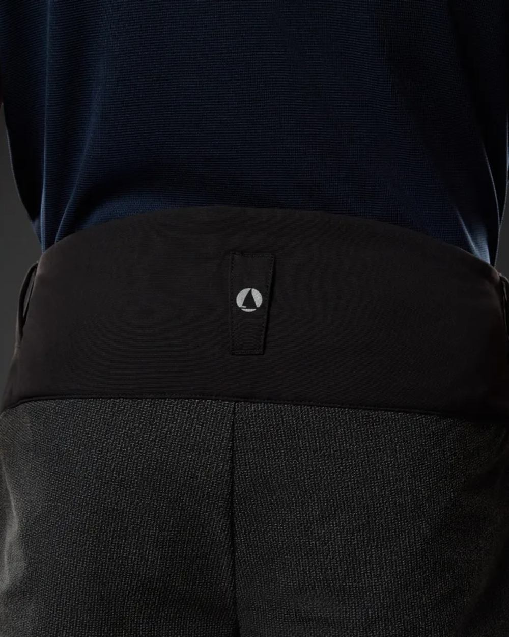 Black Coloured Musto Mens Evo Performance Stretch Shorts on studio background 