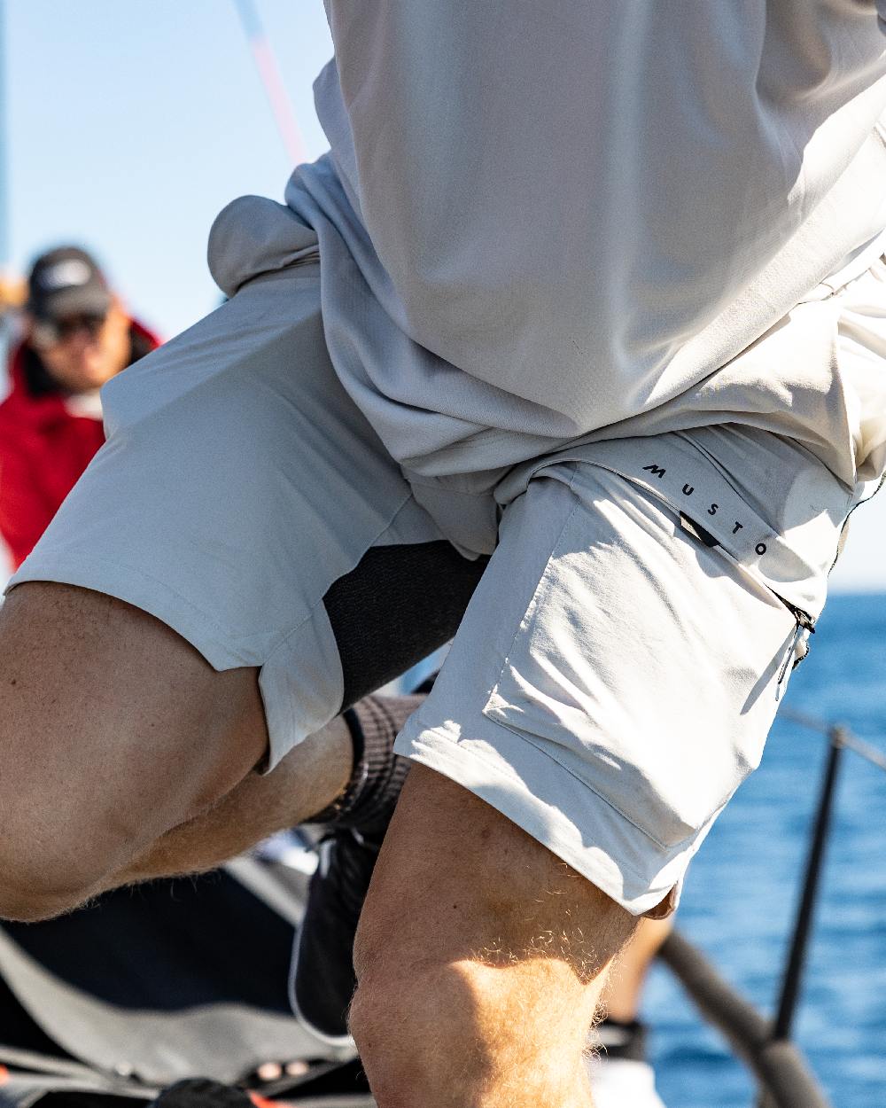 Platinum Coloured Musto Mens Evo Performance Stretch Shorts on outdoor background 