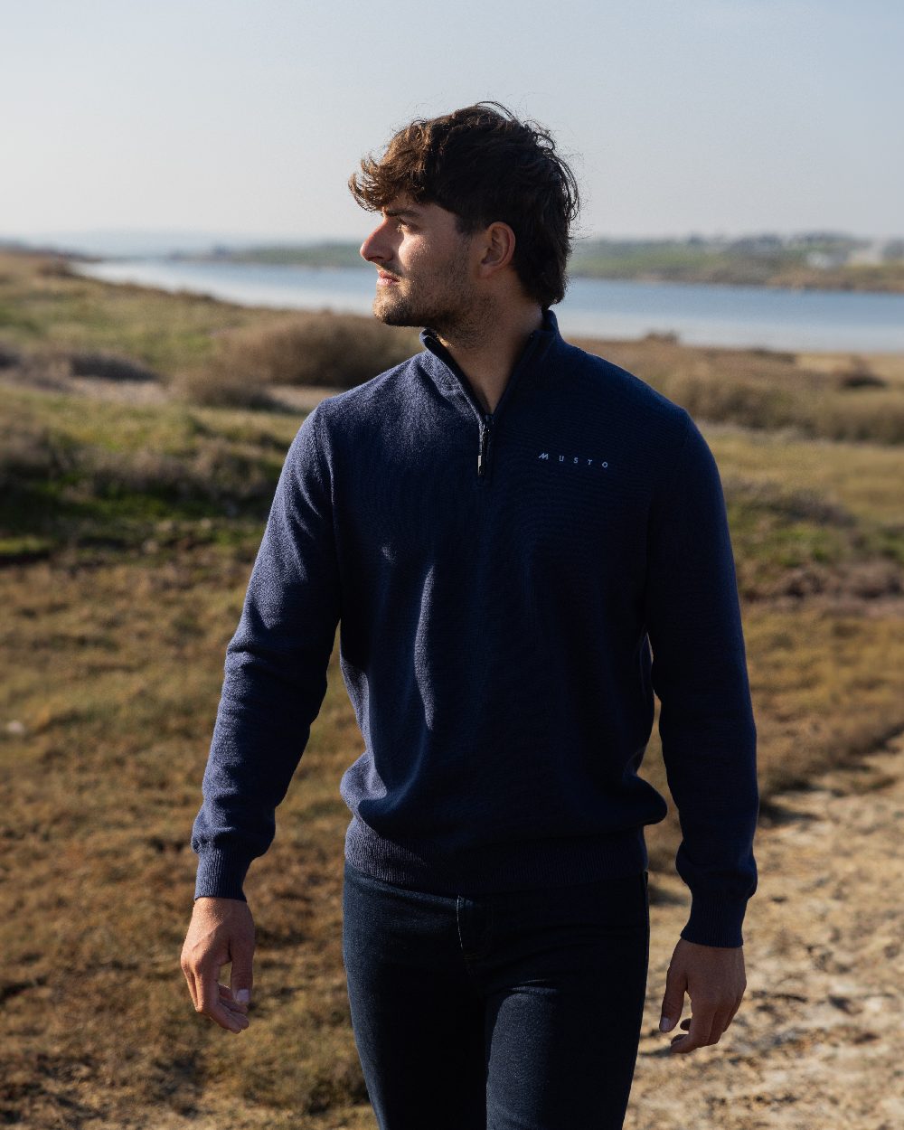 Navy Coloured Musto Mens Evo Windproof Knit Jacket on outdoor background 