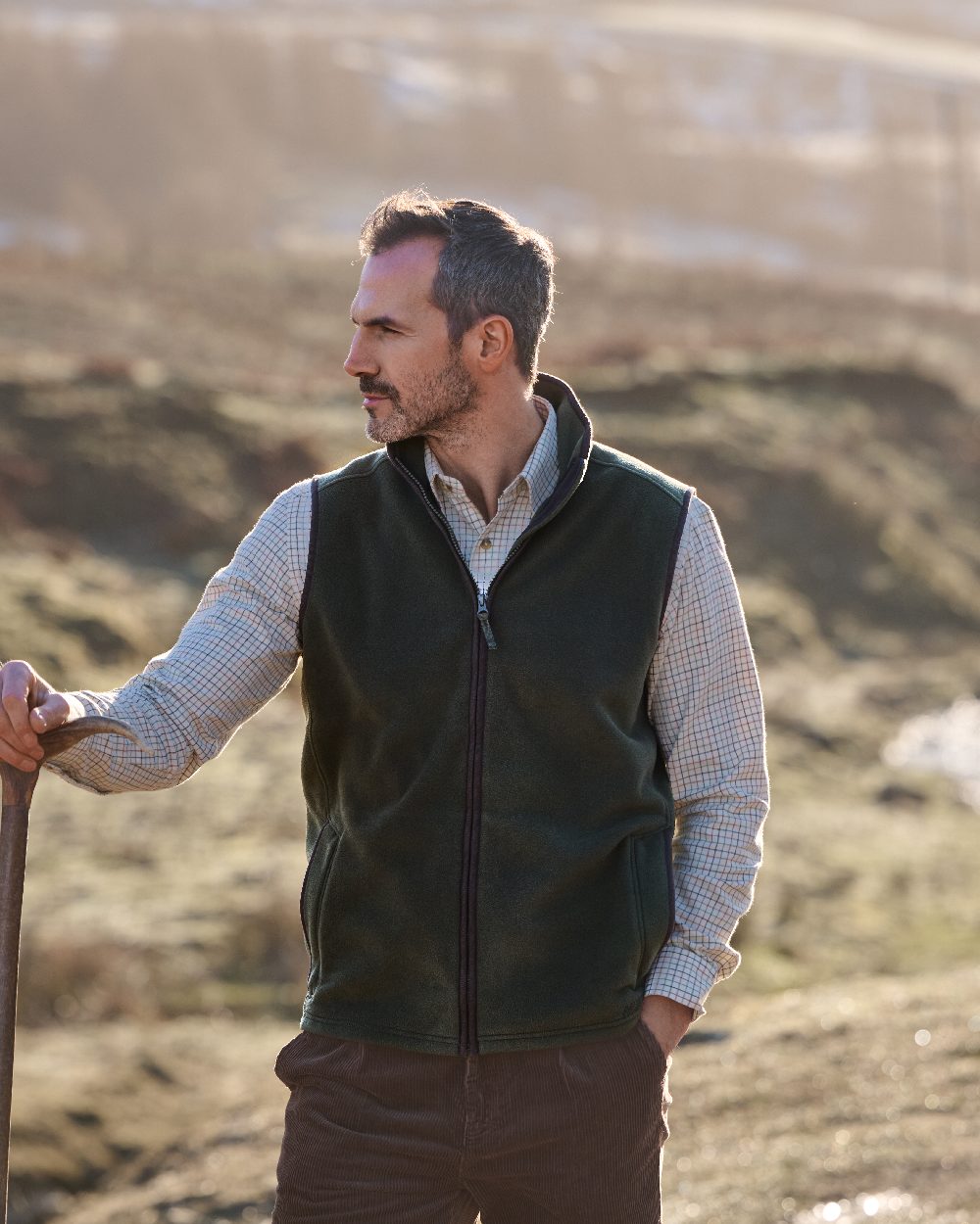Deep Green Coloured Musto Mens Fenland 200 Polartec Vest on Outdoor Background 