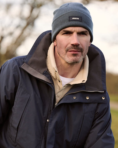 Navy Coloured Musto Mens Fenland Jacket 3.0 on country Background 
