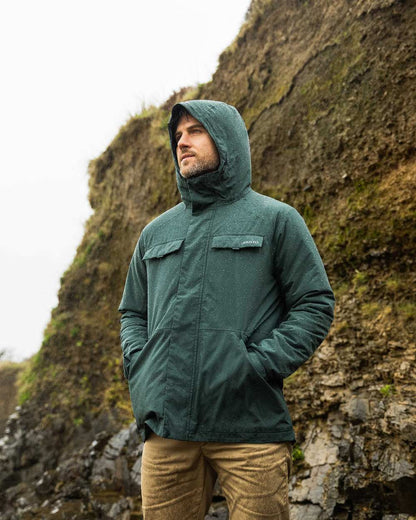 Darkest Spruce Coloured Musto Mens Insulated Rain Jacket on mountain background 