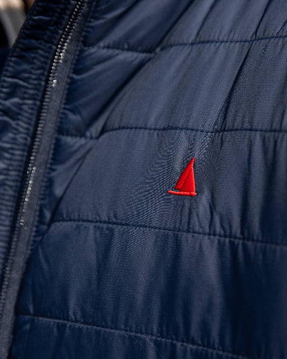 Navy Coloured Musto Mens Original Lite Puffer Jacket on outdoor  background 
