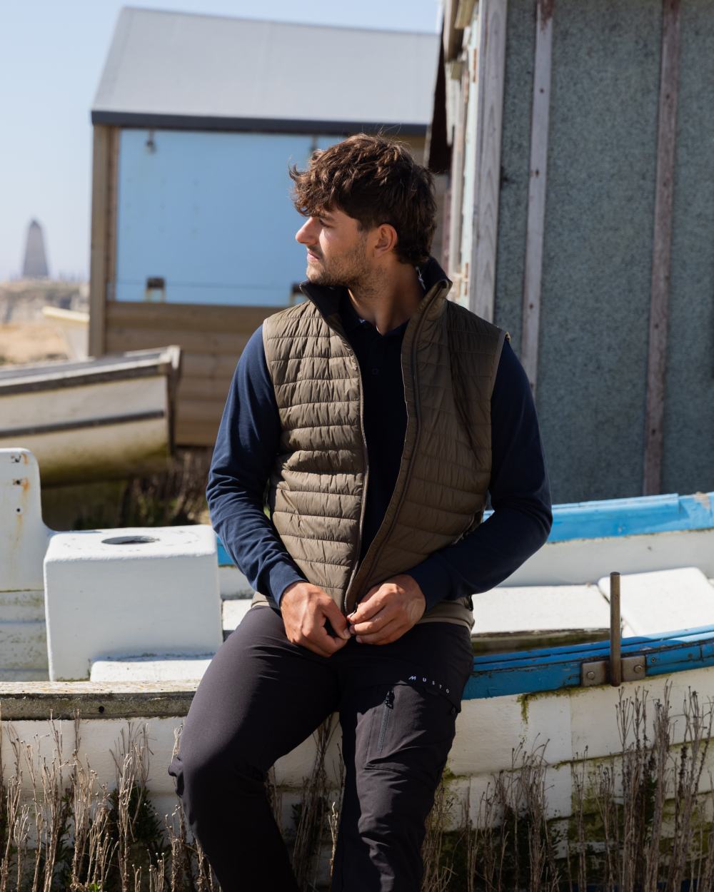 Crocodile Coloured Musto Mens Original Lite Puffer Vest on outdoor background 