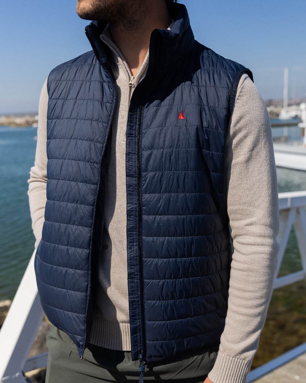 Navy Coloured Musto Mens Original Lite Puffer Vest on outdoor background 