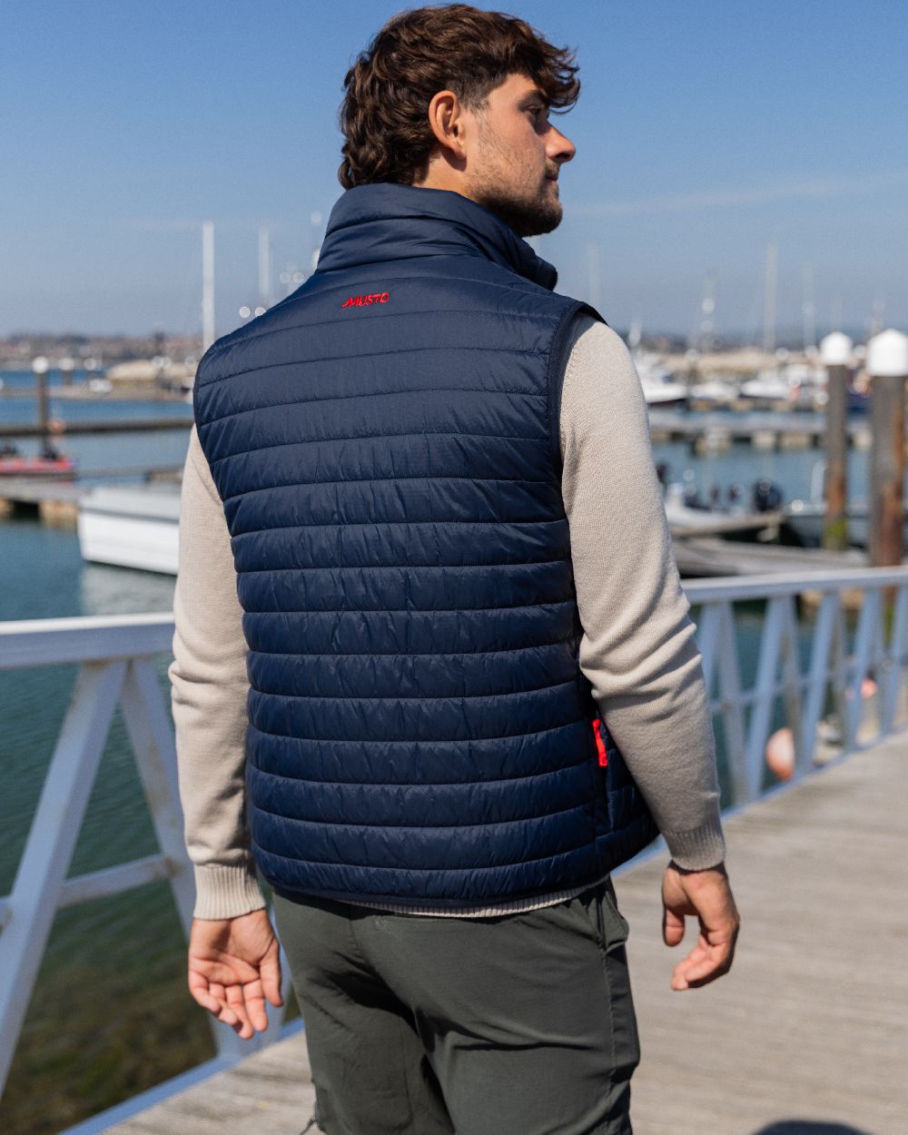 Navy Coloured Musto Mens Original Lite Puffer Vest on outdoor background 