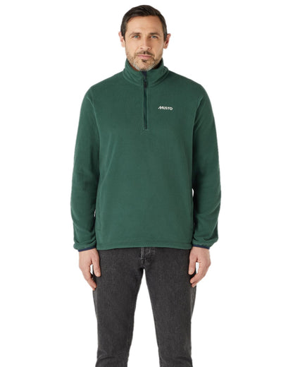 Darkest Spruce coloured Musto Snug Fleece 2.0 on white background 