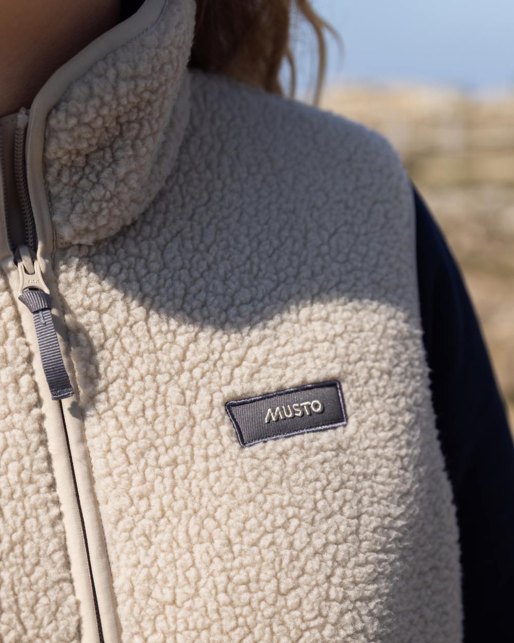 Pure Cashmere Coloured Musto Womens Cover Deep Pile Fleece Vest on outdoor background 
