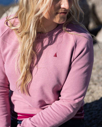 Oyster Pink Coloured Musto Womens Original Crew Sweater on outdoor background 