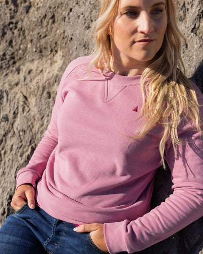 Oyster Pink Coloured Musto Womens Original Crew Sweater on outdoor background 