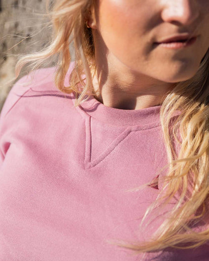 Oyster Pink Coloured Musto Womens Original Crew Sweater on outdoor background 