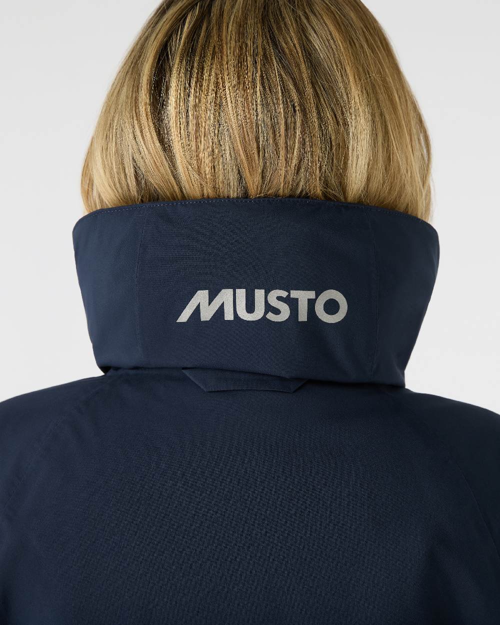 Navy Coloured Musto Womens Suffolk Waterproof Coat on White Background 