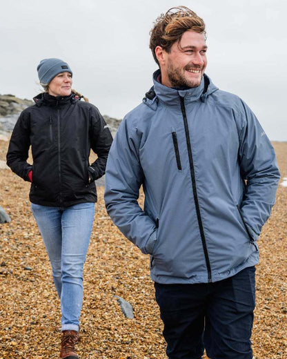 Slate Blue coloured Musto Sarinia Jacket on Beach background 