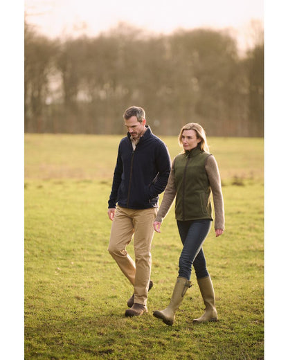 Deep Green Coloured Musto Womens Fenland 200 Polartec Vest on Field Background 