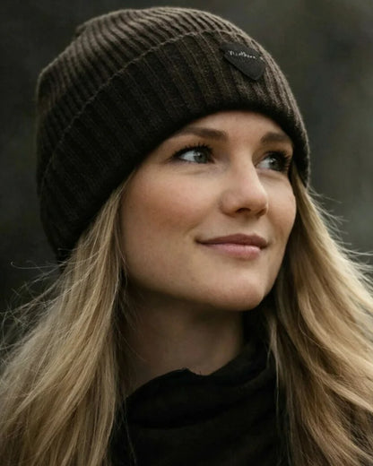 Green coloured Northern Hunting Buk Windstop Beanie on forest background 