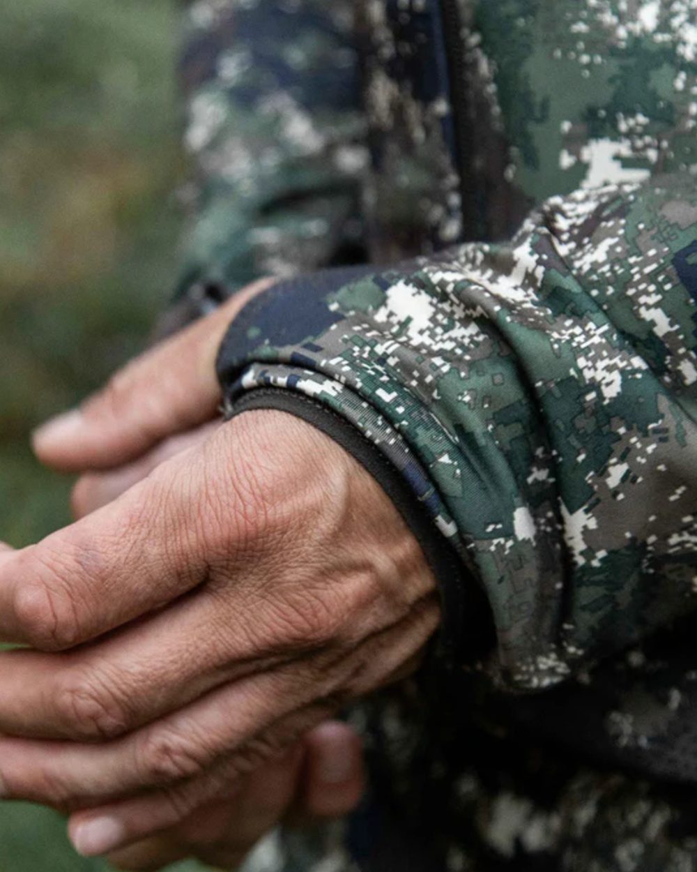 Camo coloured Northern Hunting Mens Alvar Lightweight Hunting Jacket on forest background 
