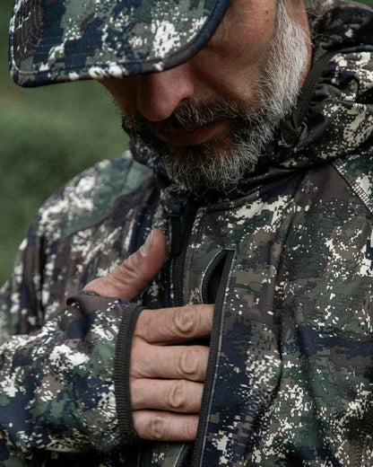 Camo coloured Northern Hunting Mens Alvar Lightweight Hunting Jacket on forest background 