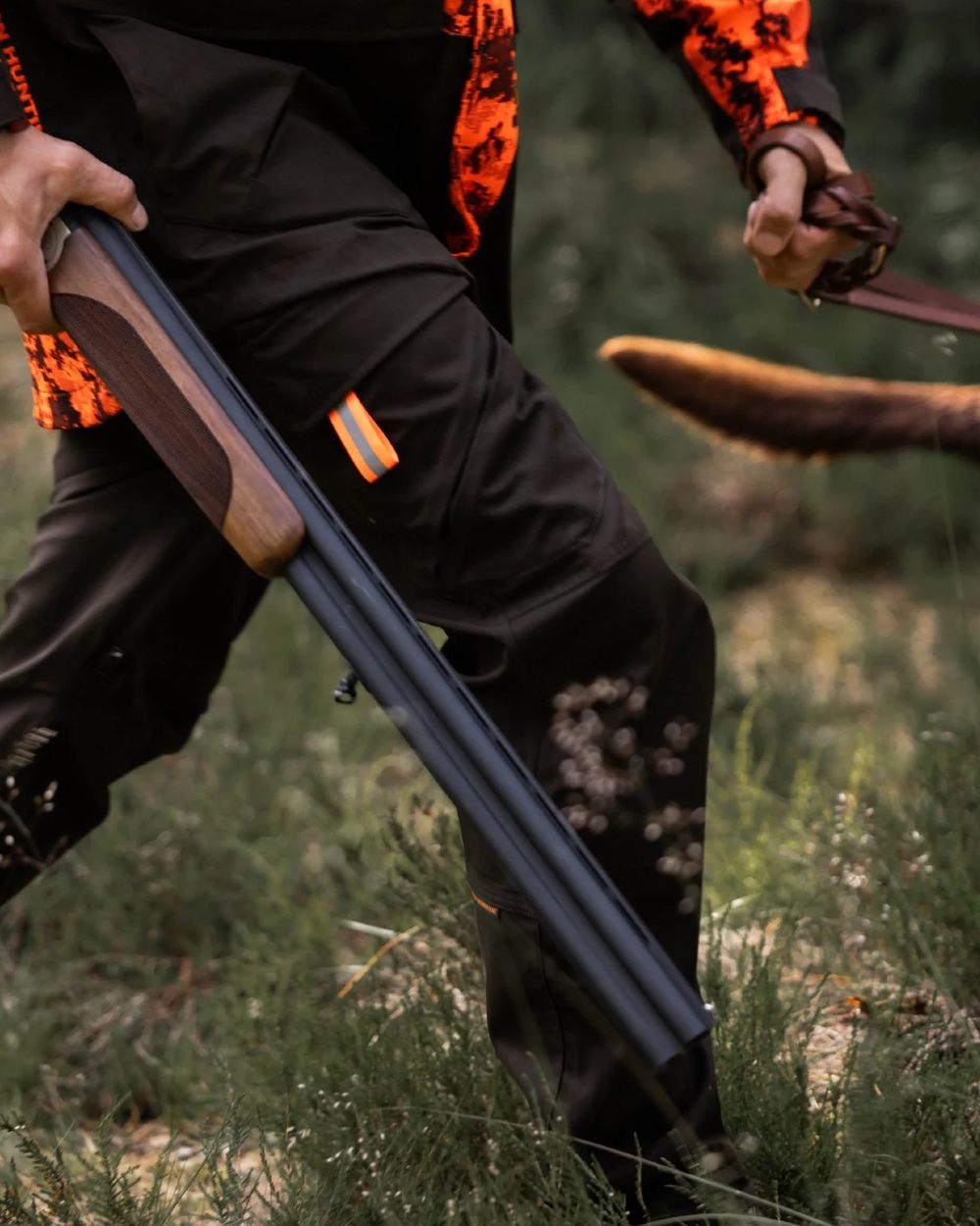 Dark Green coloured Northern Hunting Mens Falkor Vorg Waterproof Hunting Trousers on forest background 