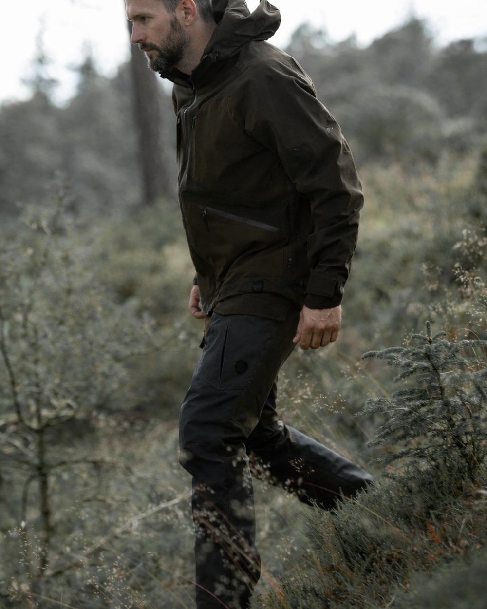 Green Blue coloured Northern Hunting Mens Geir Agnar G2 Kevlar Outdoor Trousers on forest background 