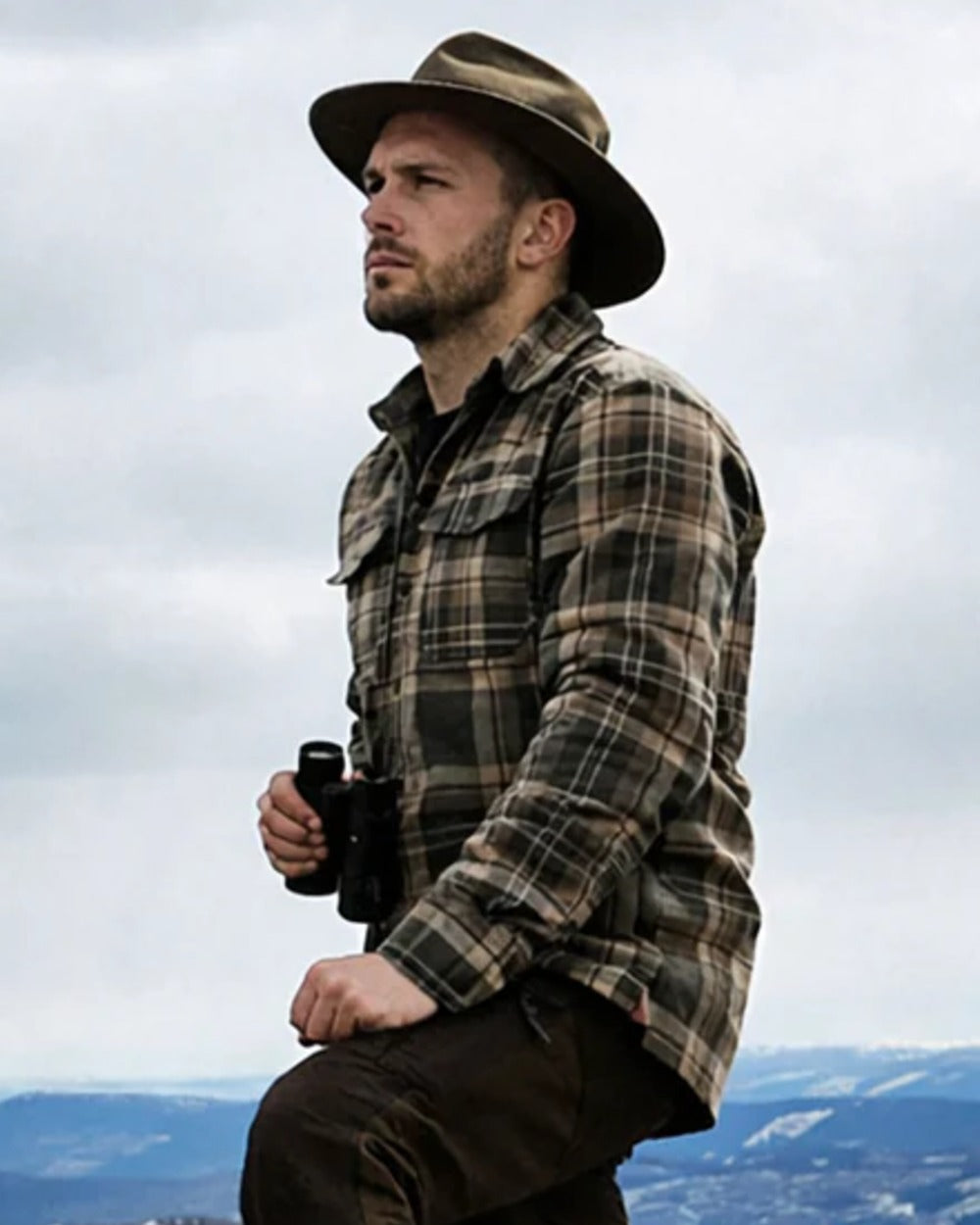 Green coloured Northern Hunting Mens Gorm Forester Shirt on sky background 