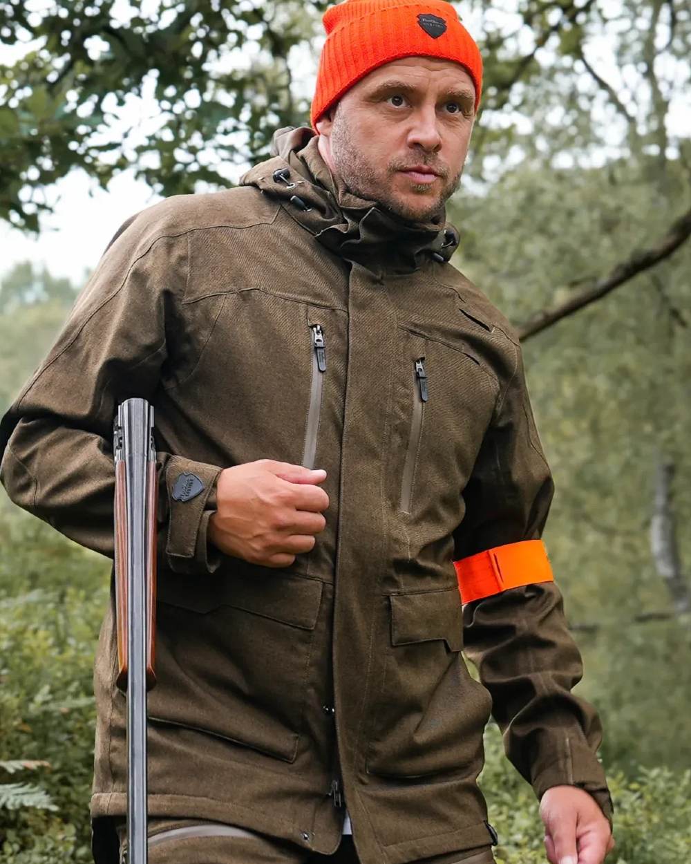 Green coloured Northern Hunting Mens Gunnar Ark Addventex Eco Waterproof Jacket on forest background 